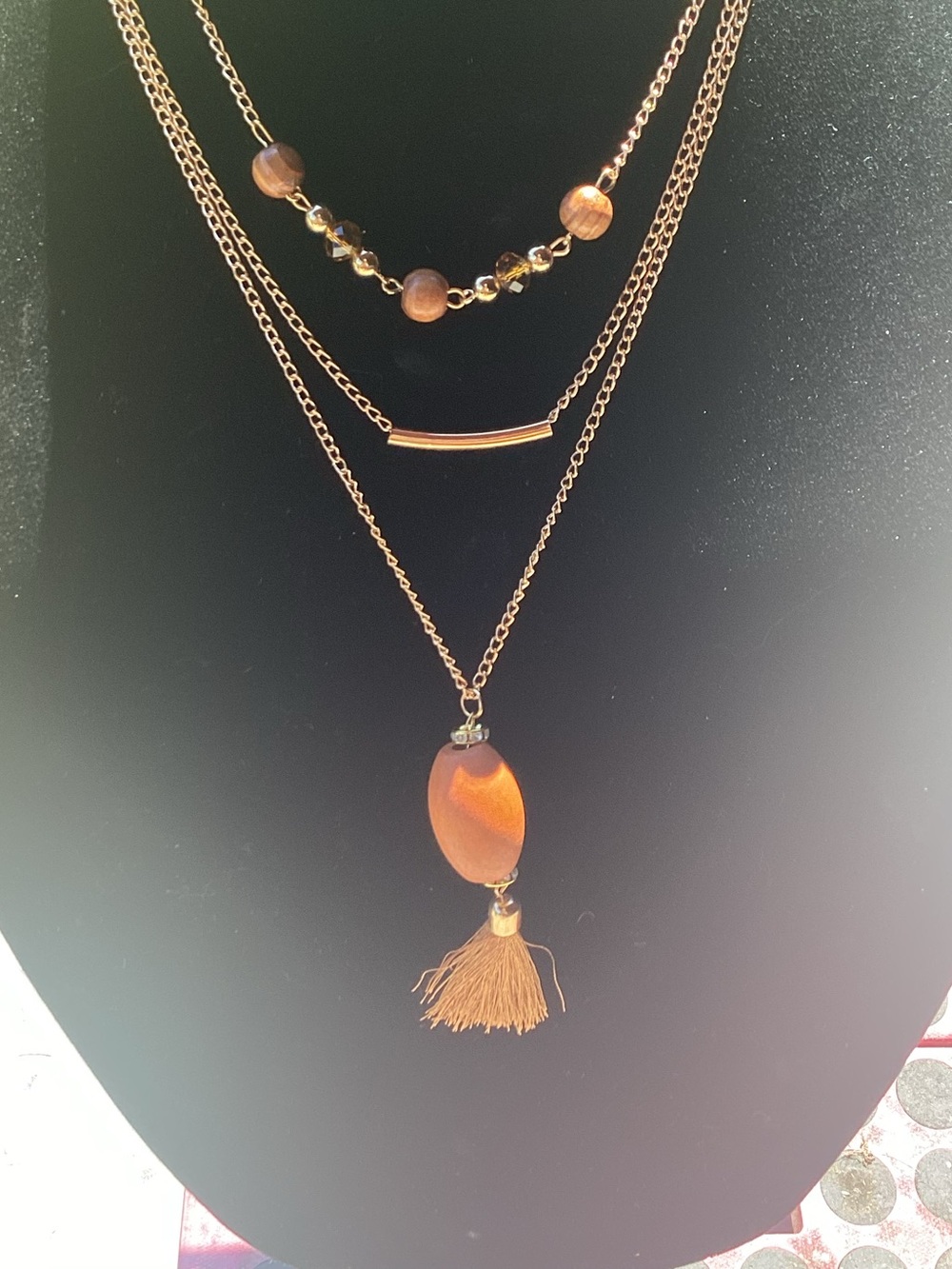 Superstar Accessories Necklace with wood, tassel and gold tone accents